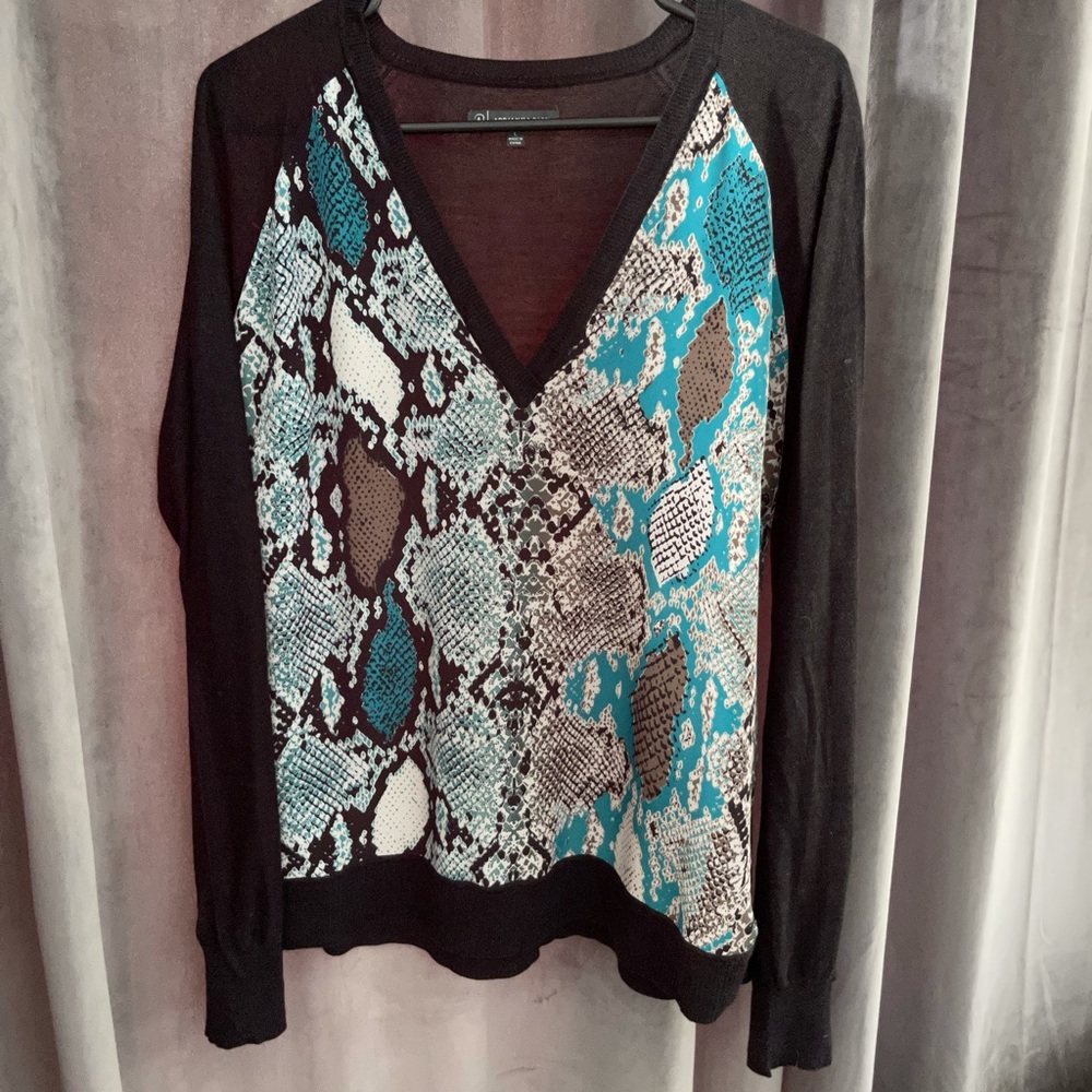 V neck sweater with animal print silky front.